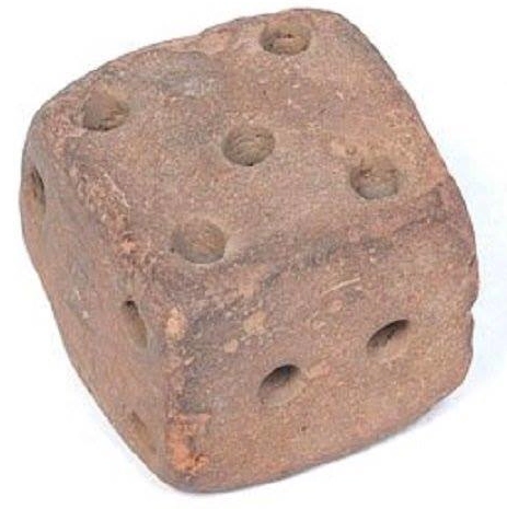 An ancient stone playing die.