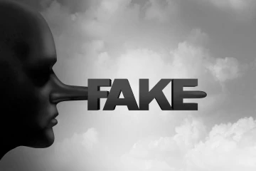 A growing nose with the word 'Fake'