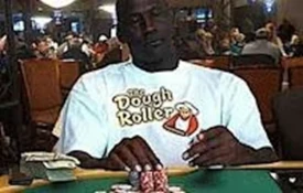 Michael Jordan sitting at a casino table wearing a 