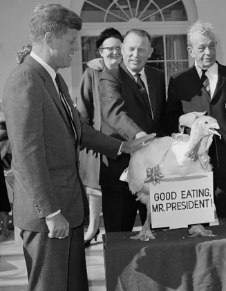 John F. Kennedy receives the presidential turkey