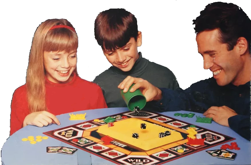 Photo of a family of three playing Showdown Yahtzee, from the 1992 game box.
